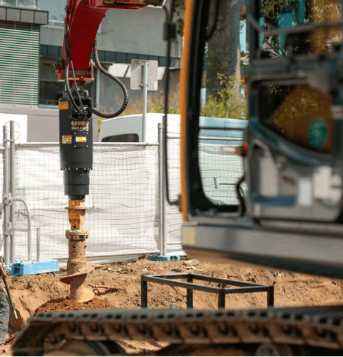 large excavator auger drive drilling hole