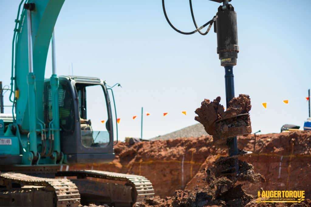 excavator auger drive drilling holes