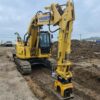 indeco compactor plate in use on komatsu