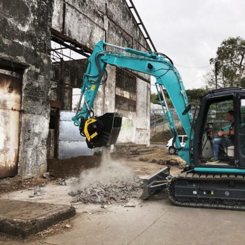 MB Crusher Bucket crushing material on a Kobelco Excavator